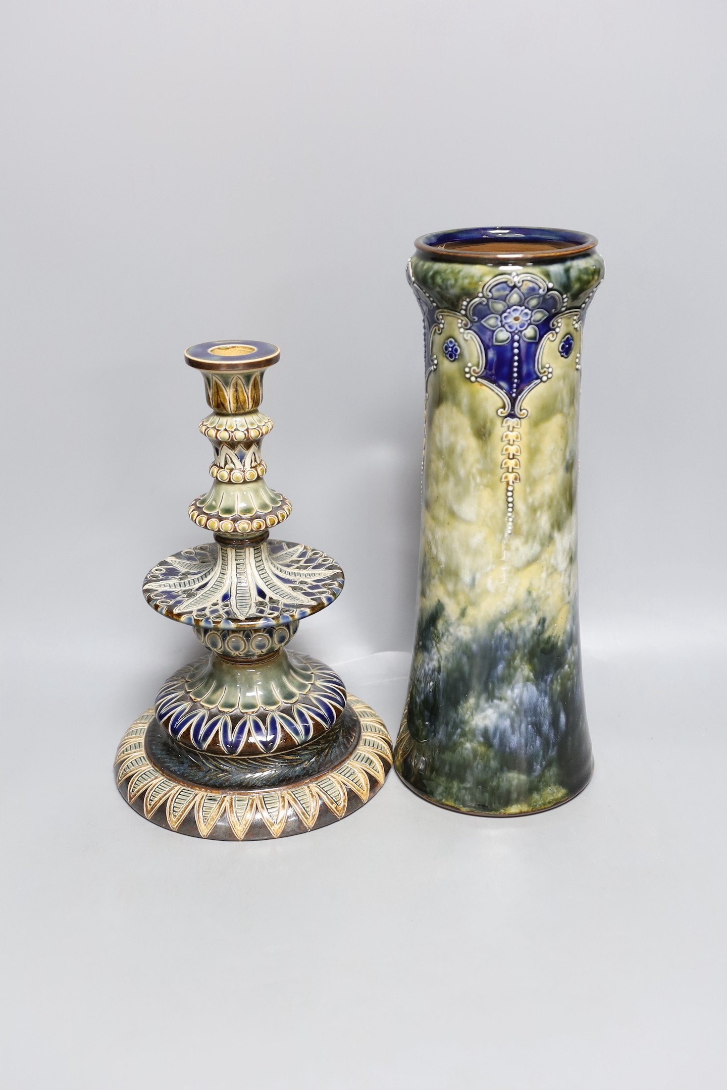 A Doulton Lambeth stoneware vase and similar candlestick by Edith D Lapton, tallest 33cm